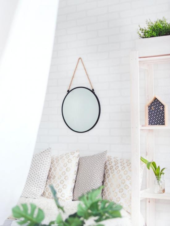 round-black-framed-mirror-on-the-wall-905198.jpg